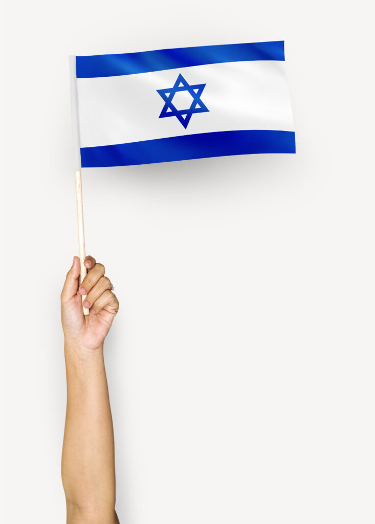 Person waving the flag of State of Israel